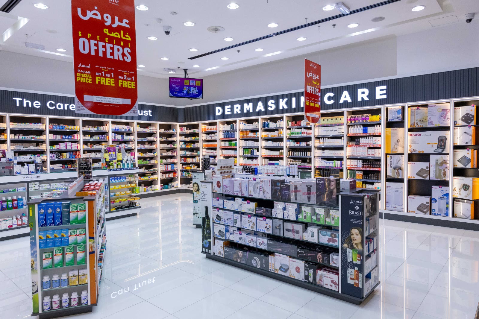 Gondolas and wall displays across the pharmacy floor