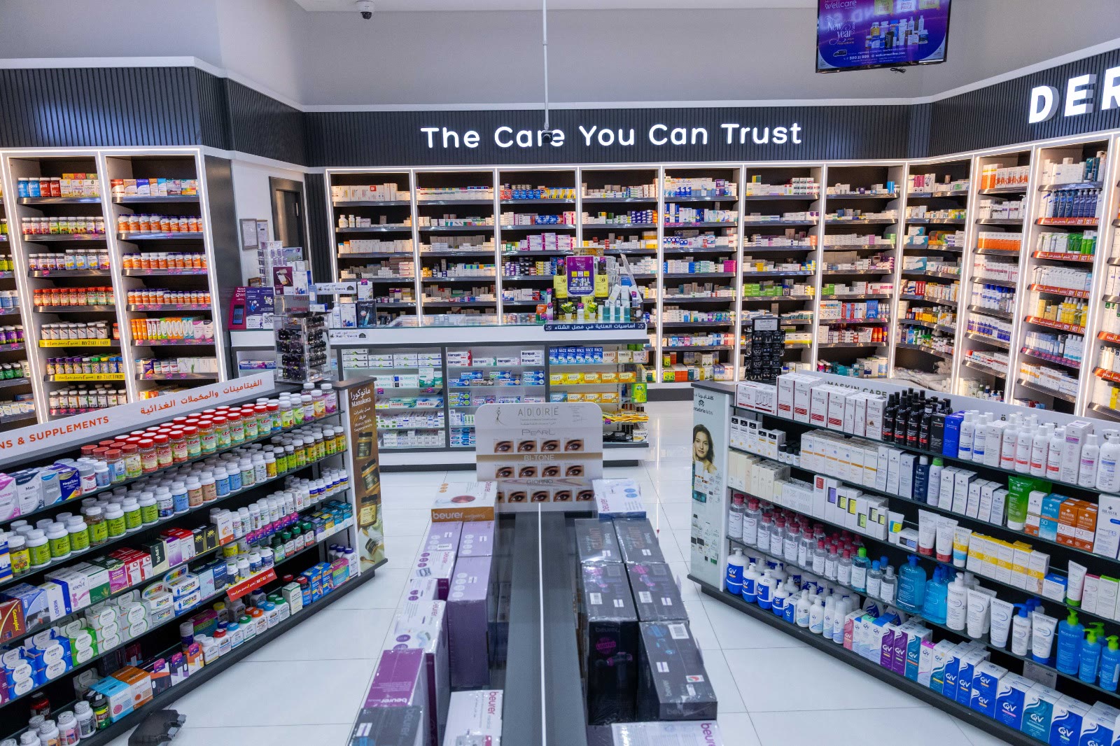 Wide view of the pharmacy floor under the 'The Care You Can Trust' sign