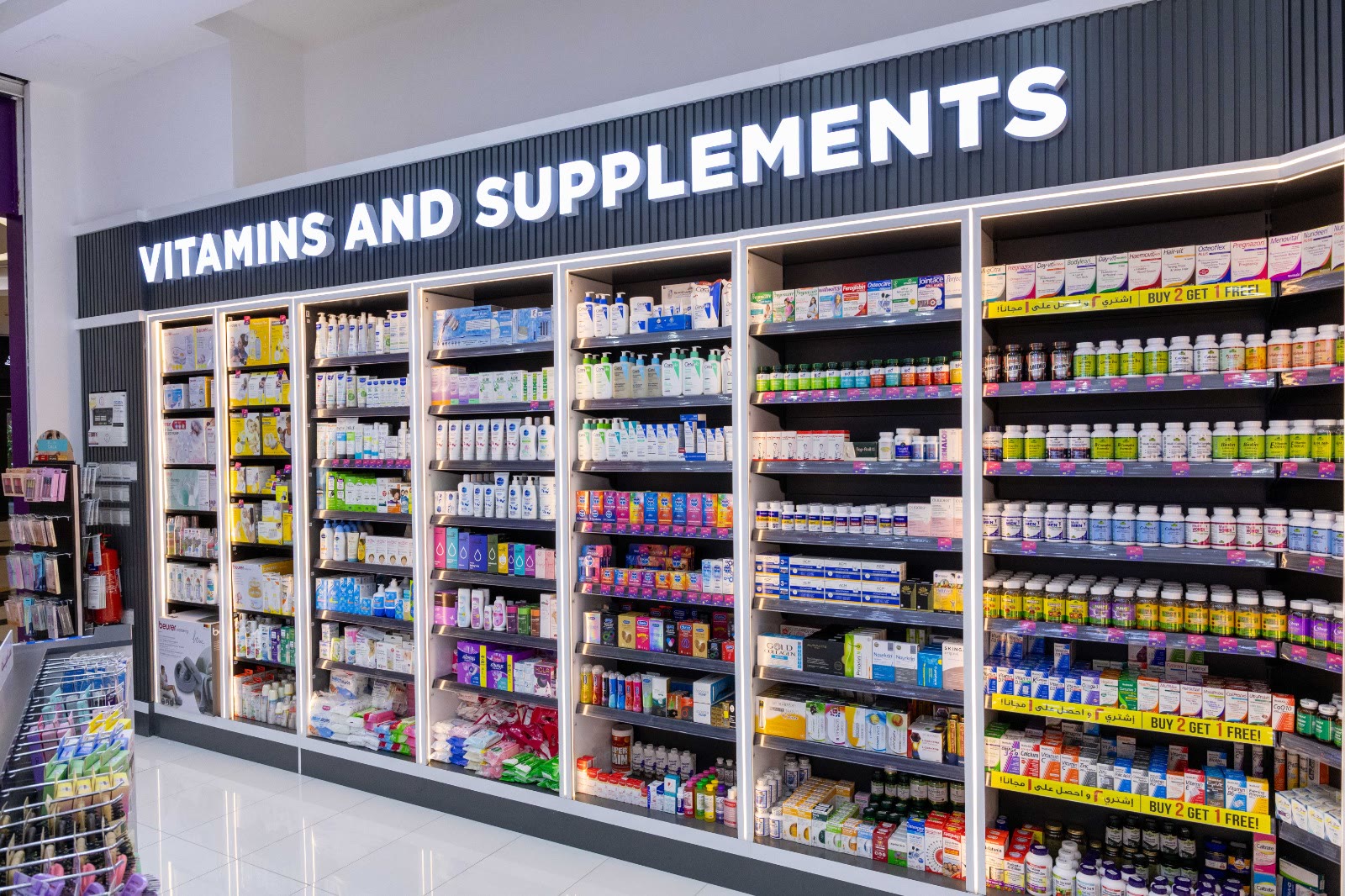 Illuminated vitamins and supplements wall fully stocked